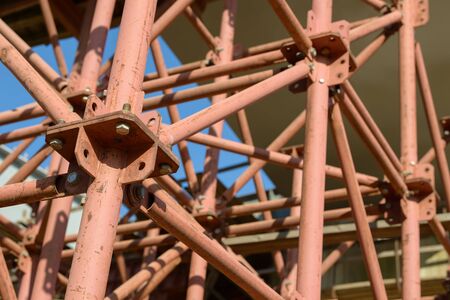Scaffolding Elements Construction. Metal scaffolding tubes and bars. Construction site details. Bridge support. Industrial background.の写真素材