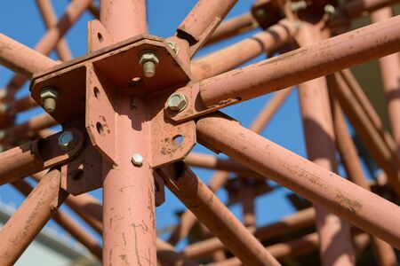 Scaffolding Elements Construction. Metal scaffolding tubes and bars. Construction site details. Bridge support. Industrial background.の写真素材