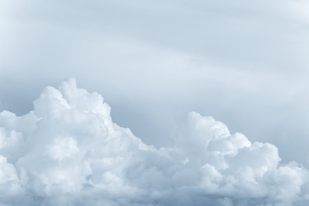 White big fluffy clouds. Natural scenic abstract background. Weather changes backdrop. Sky filled...