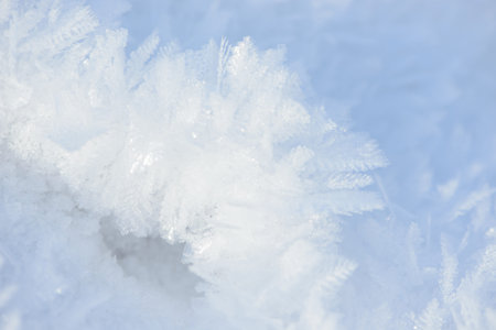 Hoarfrost background texture. Fresh ice and snow winter backdrop with snowflakes and mounds....