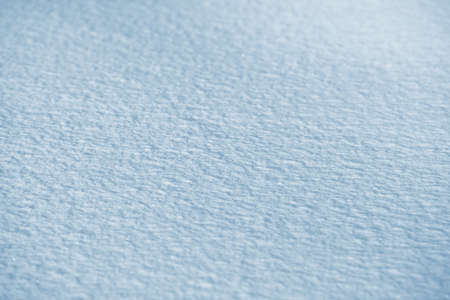 Fresh clean white snow background texture. Winter background with frozen snowflakes and snow mounds. Snow lumps. Seasonal landscape details. Cold weather.の写真素材