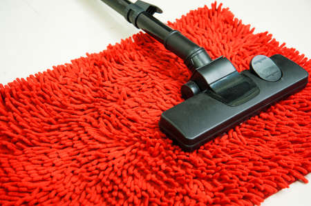 Vacuum cleaner on Red Carpetの写真素材