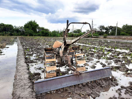 a tractor when not being used by farmersの写真素材