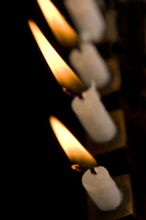Beautiful lit hanukkah menorah on black. の写真素材