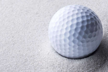 golf ball in sand trapの写真素材