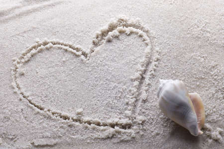heart drawn in sand with copy spaceの写真素材