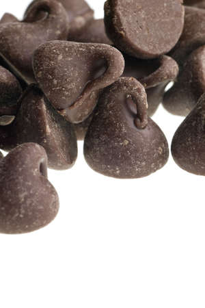 chocolate chips isolated on white backgroundの写真素材