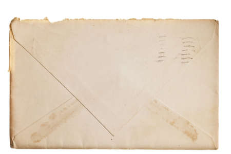 Vintage yellowed envelope isolated on whiteの写真素材
