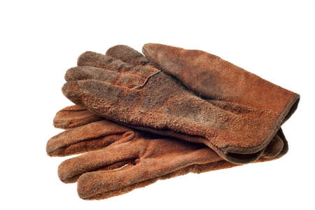 old grungy work gloves isolated on white backgroundの写真素材