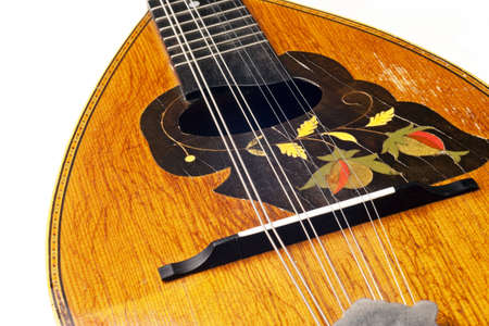 antique mandolin isolated on white backgroundの写真素材