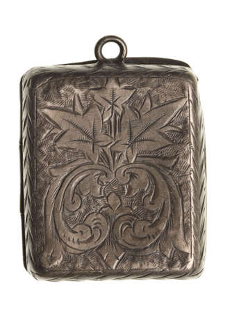 antique silver locket isolated on white backgroundの写真素材