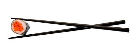 Sushi roll and black chopsticks isolated on white backgroundの写真素材