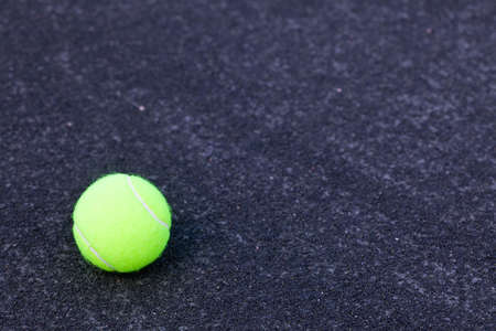 tennis ball on court background with copy spaceの写真素材