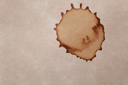 coffee stain isolated on a parchment paper backgroundの写真素材