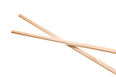 disposable wooden Chinese chopsticks isolated on whiteの写真素材