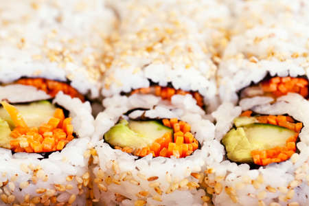 Vegetarian sushi California roll with rice and seaweed backgroundの写真素材