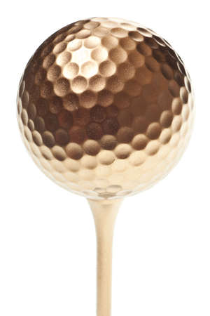 gold golf ball isolated on a pure white backgroundの写真素材