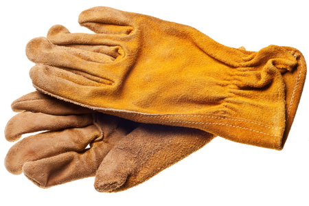 old grungy work gloves isolated on white backgroundの写真素材