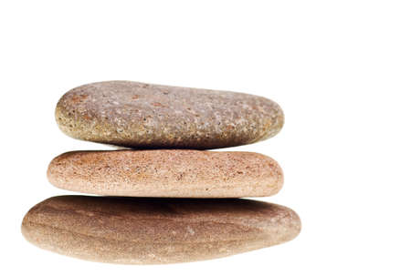 river rocks stacked isolated on a white backgroundの写真素材