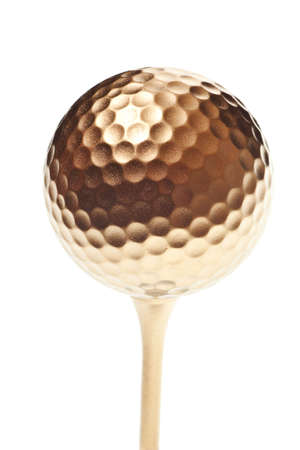 gold golf ball isolated on a pure white backgroundの写真素材