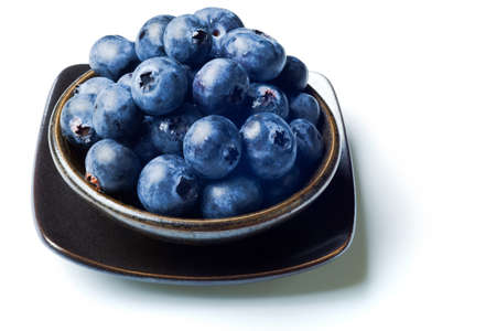 Japanese bowl with blueberries isolated on  white with drop shadowの写真素材