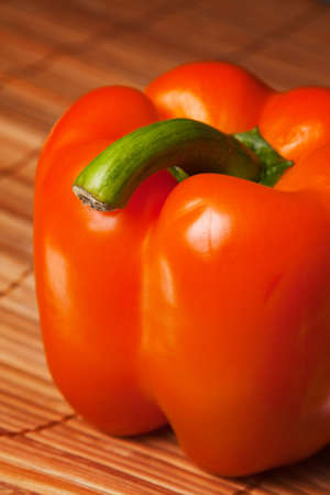 red pepper isolated on a bamboo mat backgroundの写真素材