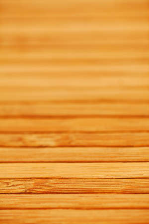 natural bamboo slatted mat background in brown tonesの写真素材