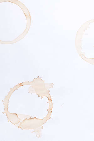 coffee ring stains on white paper backgroundの写真素材