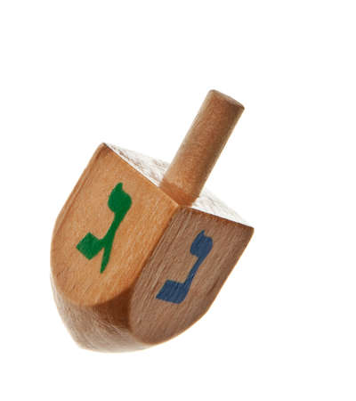 hanukkah dreidel isolated on a white backgroundの写真素材