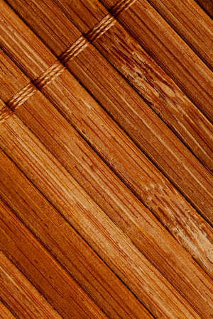 natural bamboo slatted mat background in brown tonesの写真素材
