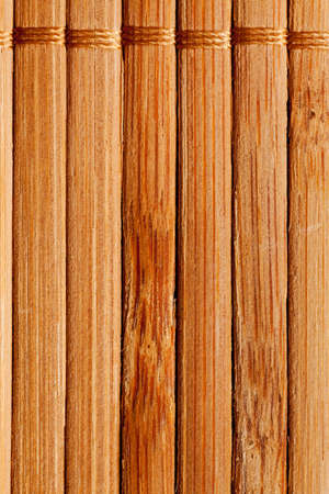 natural bamboo slatted mat background in brown tonesの写真素材