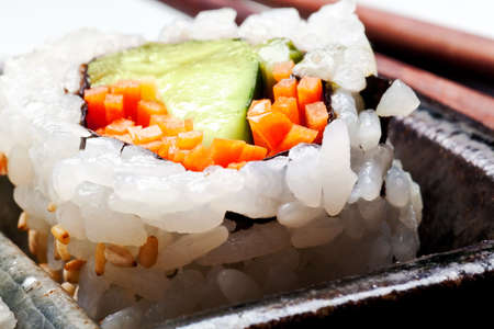 Vegetarian sushi California roll with rice and seaweed on Japanese platesの写真素材