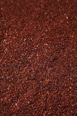 brown coffee grounds arranged as a backgroundの写真素材
