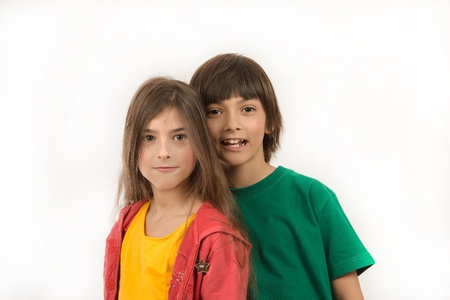 Girl and boy posing on white backgroundの写真素材