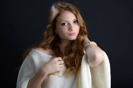 portrait of a beautiful blonde young woman in studioの写真素材