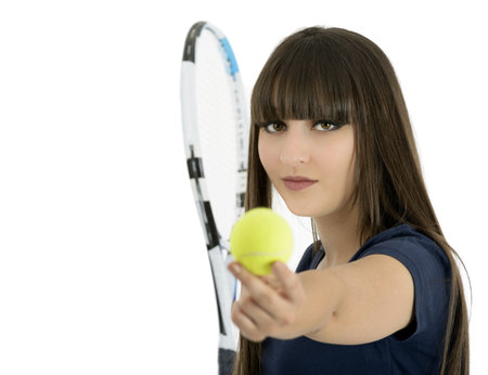 A pretty, athletic female tennis player isolated on a white background の写真素材