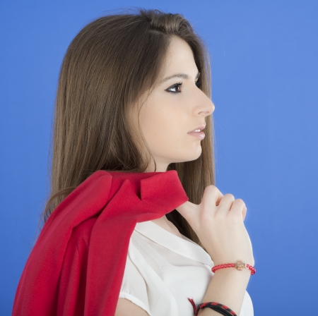 Portrait of urban business woman wearing tie, isolated on blueの写真素材