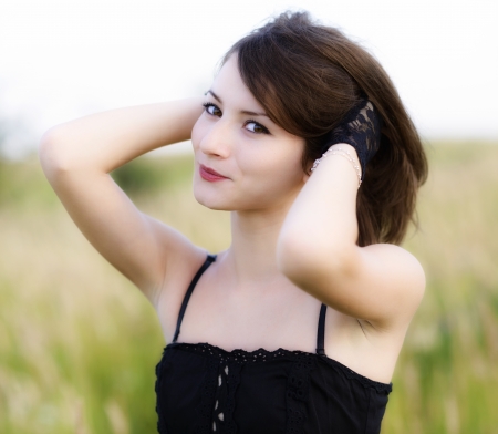 Romantic young woman posing outdoor の写真素材