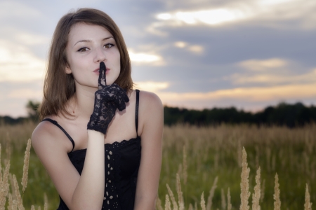 Romantic young woman posing outdoor の写真素材