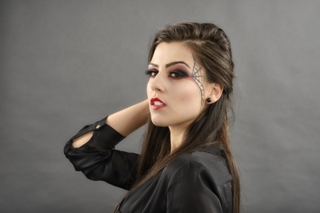 beauty portrait of young glamour beautiful halloween womanの写真素材