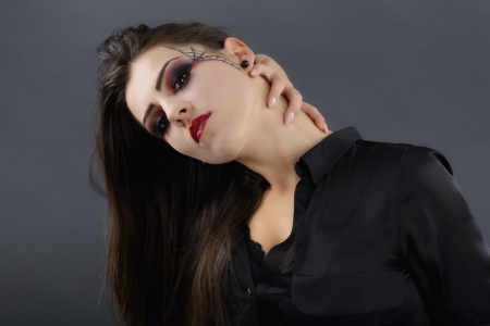 beauty portrait of young glamour beautiful halloween womanの写真素材