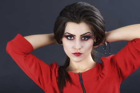 beautiful woman with halloween makeup isolated on black backgroundの写真素材