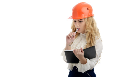 Thoughtful female engineer, isolated on a white backgroundの写真素材