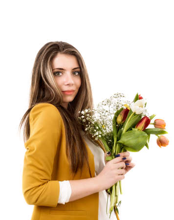 young woman with tulips isolated on a white backgroundの写真素材