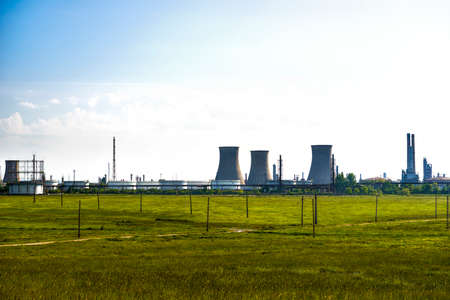 oil refinery plant against blue skyの写真素材