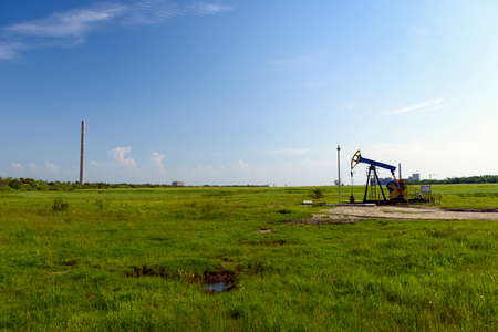 oil refinery plant against blue skyの写真素材
