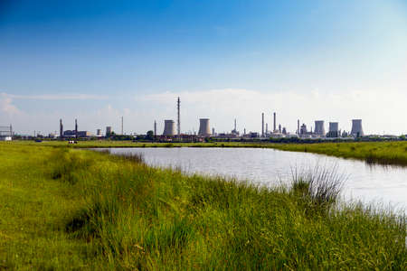 oil refinery plant against blue skyの写真素材