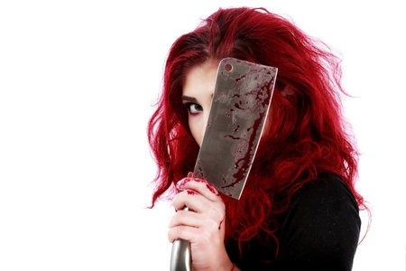 redhead woman with a bloody hatchet in hand
