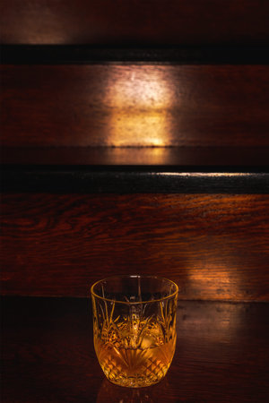 Whiskey drink on wooden table