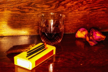 Whiskey drinks with cigars on wooden tableの写真素材